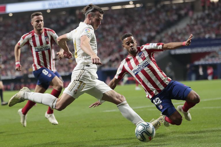 Gareth Bale is flanked by two Atl&Atilde;&copy;tico&Acirc;&nbsp;players at the Wanda Metropolitano