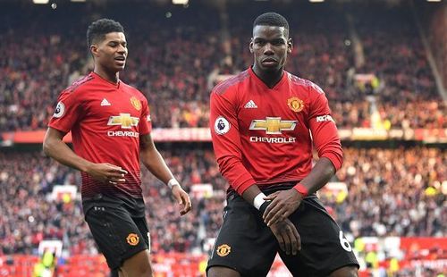 Paul Pogba celebrates with Marcus Rashford.