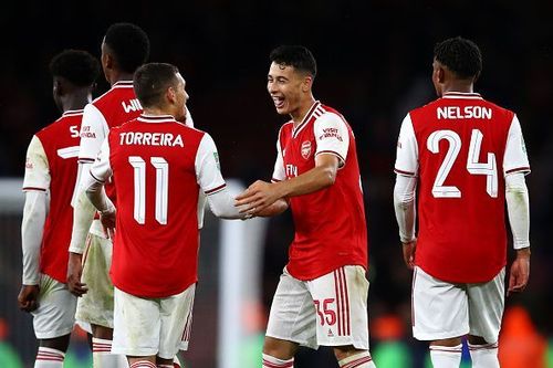 Arsenal players celebrate a goal