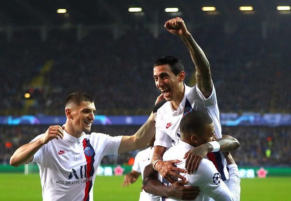 Mbappe celebrates with his teammates during a second-half blitz against Brugge