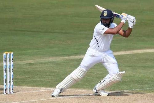 Rohit Sharma cuts a short delivery behind point.