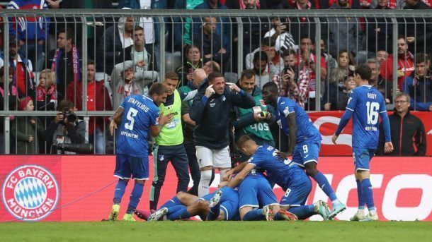 Hoffenheim players celebrate their second goal during a memorable win