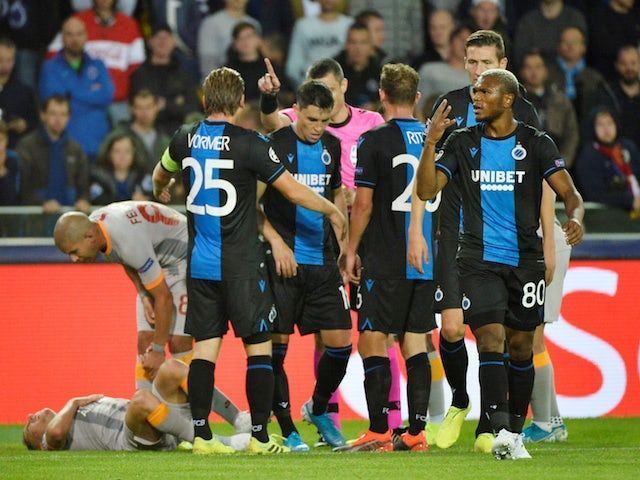 Club Brugge (in blue and black)