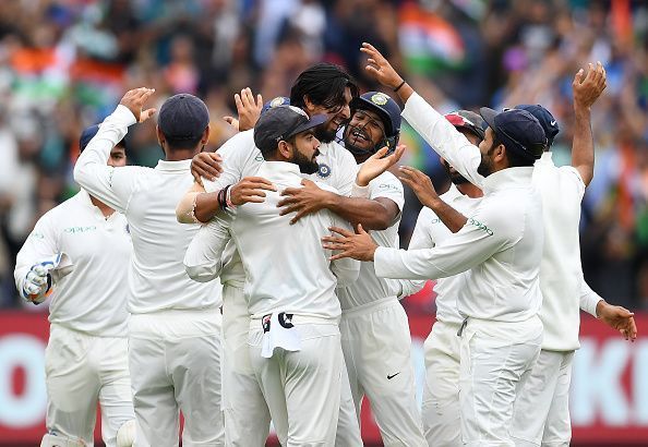 The Indian test cricket team celebrating a wicket