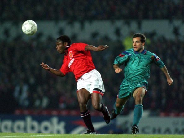 Paul Parker (l) in action for Manchester United