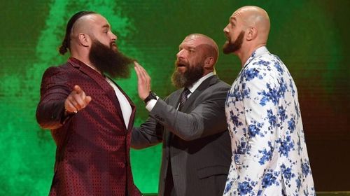 Triple H trying to restore order in the confrontation between Tyson Fury and Braun Strowman at the Las Vegas press conference.