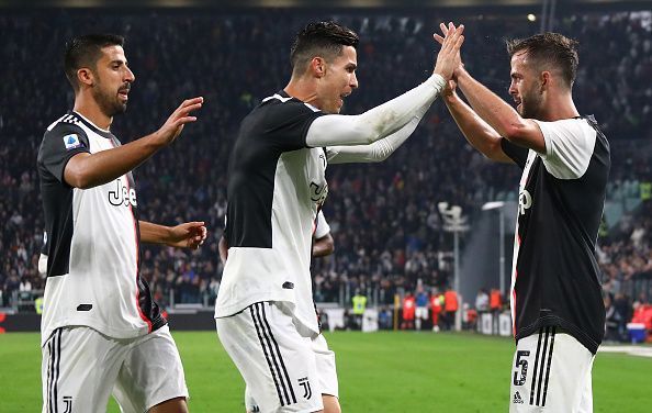 Juventus players celebrate their second goal of the evening