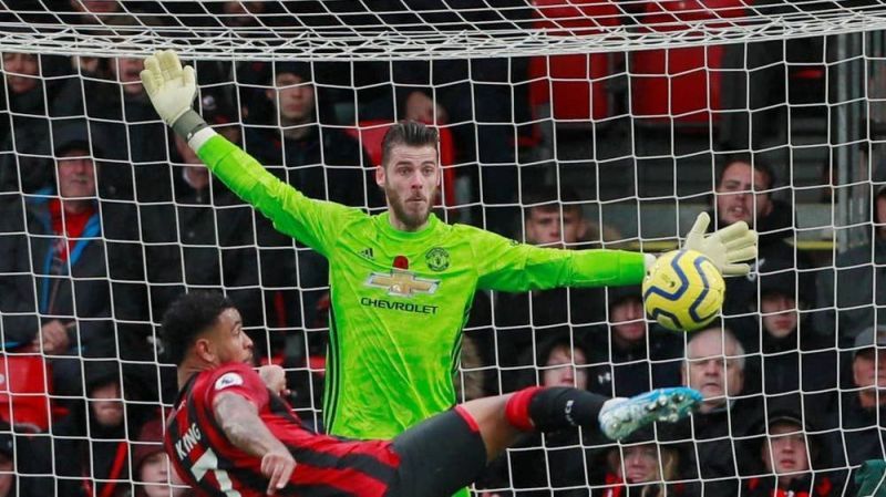 Joshua King about to score the match-winner past David de Gea