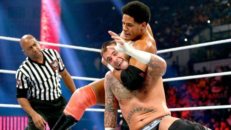 Darren Young puts CM Punk in a headlock