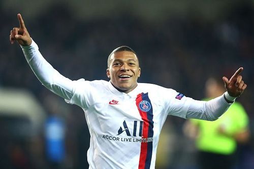 Kylian Mbappe rejoices after scoring a goal against Brugge.