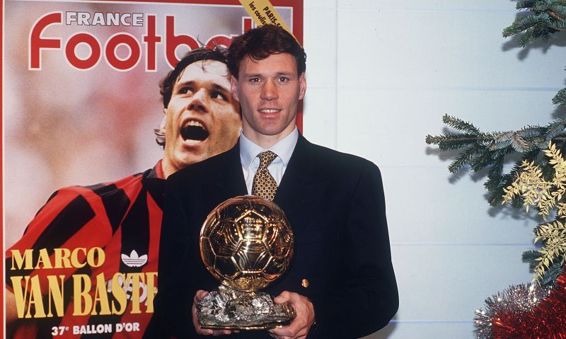 Marco van Basten poses with one of his Ballon d&#039;Or trophies
