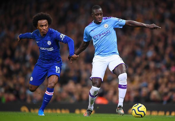 Benjamin Mendy jostling for the ball with Willian