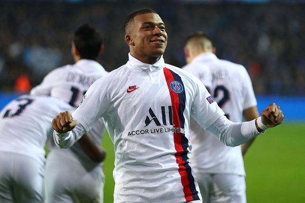 Kylian Mbappe celebrates after scoring a goal against Brugge.