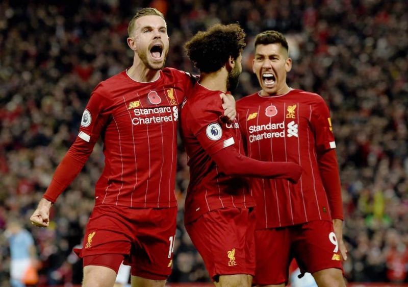 Liverpool players celebrate their second goal.