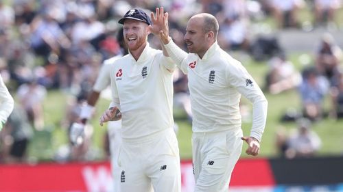 Jack Leach (right) celebrates taking the wicket of Jeet Raval with Ben Stokes