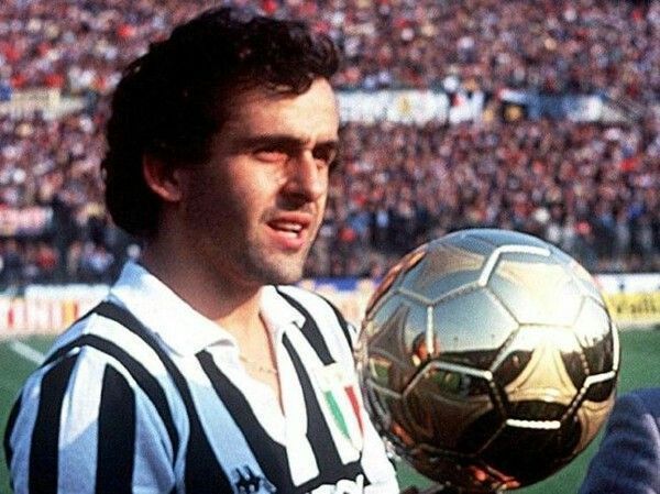 Michel Platini poses with one of Ballon d&#039;Or trophies