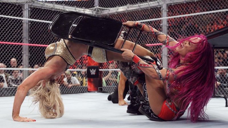 Charlotte applies the Figure Eight leglock on Sasha Banks in their Hell in a Cell encounter