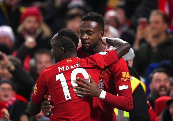 Divock Origi celebrates one of his goals with Sadio Mane during Liverpool&#039;s 5-2 Merseyside Derby win