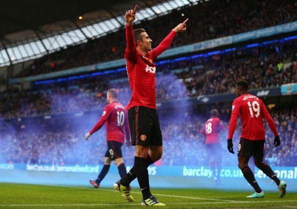 Robin van Persie celebrating his goal in a Manchester Derby