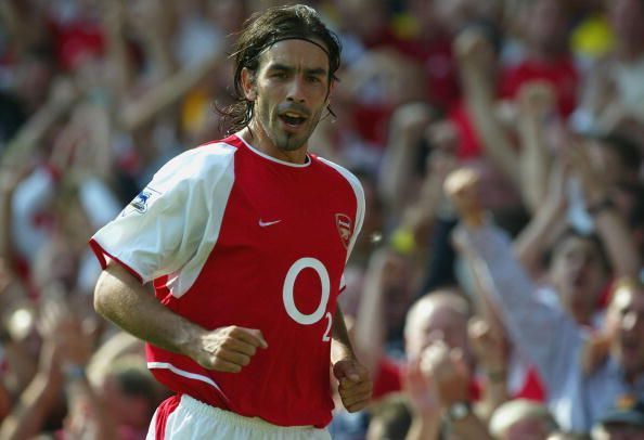 Robert Pires of Arsenal celebrates scoring a goal