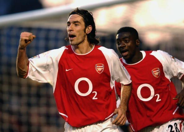 Robert Pires of Arsenal celebrates scoring Arsenal&#039;s winning goal