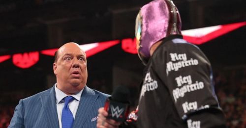 Paul Heyman and Rey Mysterio.