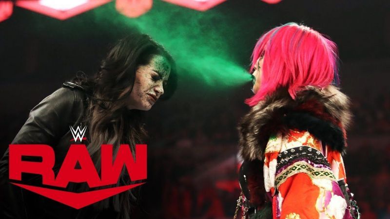 Asuka unleashes her poisonous Green Mist attack on former ally Paige.