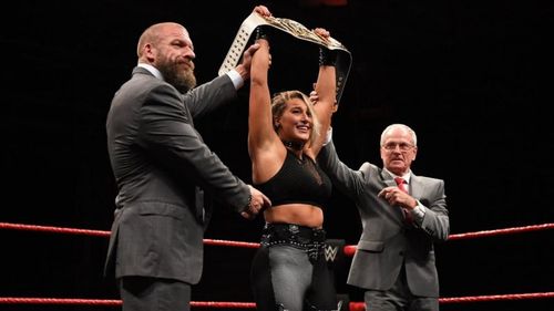 Johnny Saint and Triple H with Rhea Ripley