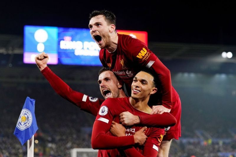 Henderson and Robertson celebrate with Trent Alexander-Arnold after his well-taken goal against Leicester