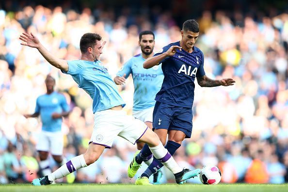 Manchester City&#039;s Laporte launches into a tackle