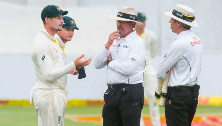 Cameron Bancroft being interrogated by on-field umnpires over the ball-tampering incident
