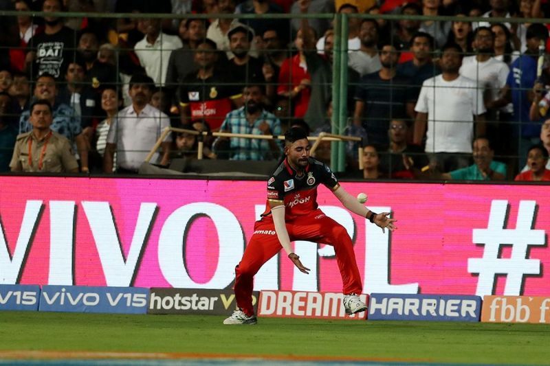 Mohammed Siraj slightly fumbles as he fields for RCB