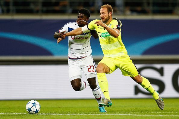 Samuel Umtiti (L) playing for Lyon