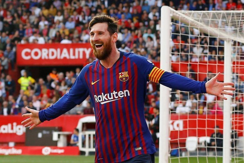 Lionel Messi rejoices after scoring against Sevilla