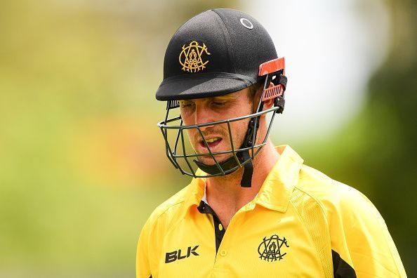 Mitchell Marsh walks back after a dismissal