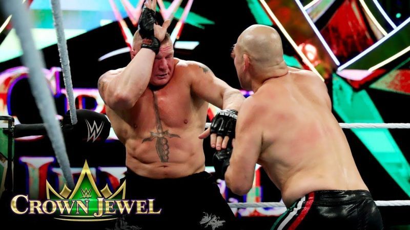 Cain Velasquez battling out Brock Lesnar in a pro-wrestling match.