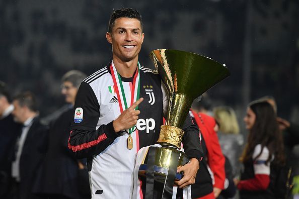 Cristiano Ronaldo poses with his first Serie A title