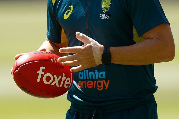 Australia's opener with a bandaged thumb