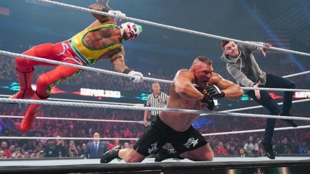 Rey Mysterio and Dominik hit Brock Lesnar with a double 619!