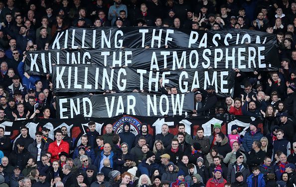 Home fans held banners calling for the removal of VAR at the start of the game
