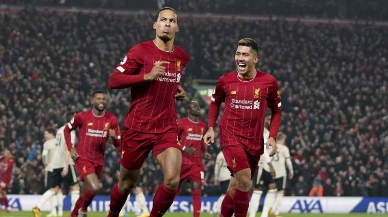 Liverpool players celebrate after the first goal