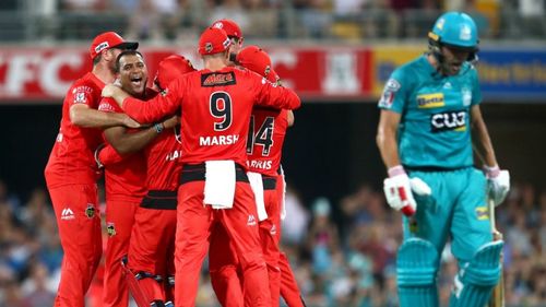 Joe Burns trudges off, watched by a jubilant Samit Patel