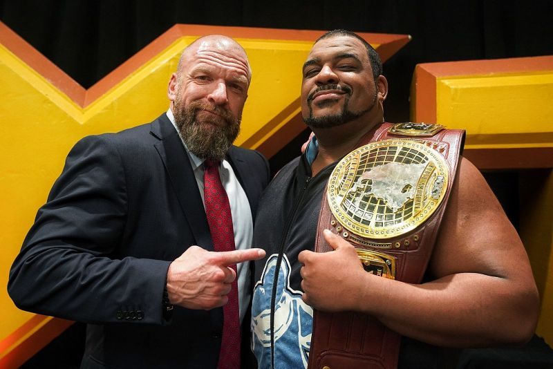 Keith Lee posing with Triple H after winning the NXT North American title