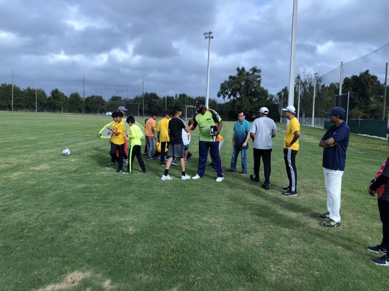 Dunae Nathaniel, former USA Player, U19 player (2006) &amp; Antigua U13, U16 &amp; U19 player interacting with Adam Hassan with other coaches &amp; youth participants