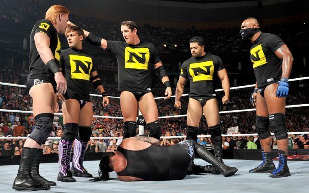 Nexus members (l to r) Heath Slater, Justin Gabriel, Wade Barrett, David Otunga, and Michael Tarver attack The Undertaker