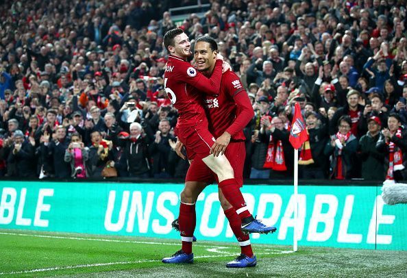 Andrew Robertson and Van Dijk celebrate a goal.