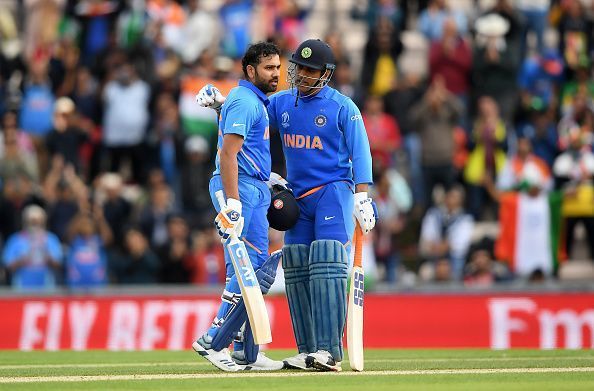Rohit Sharma celebrates his century against SA with MS Dhoni at the CWC