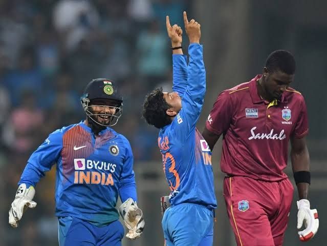 Kuldeep Yadav celebrates the fall of a wicket