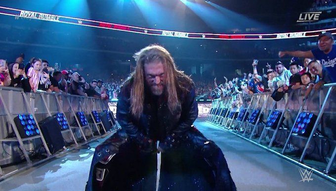 Edge before hitting his signature pose