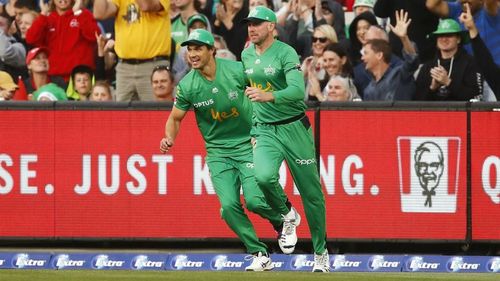 Ben Dunk and Nathan Coulter-Nile celebrate the match-turning catch